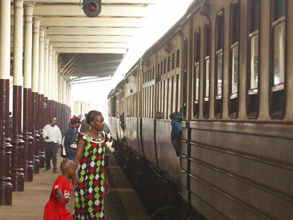 A woman and child board the Uganda-Kenya railway in Nairobi