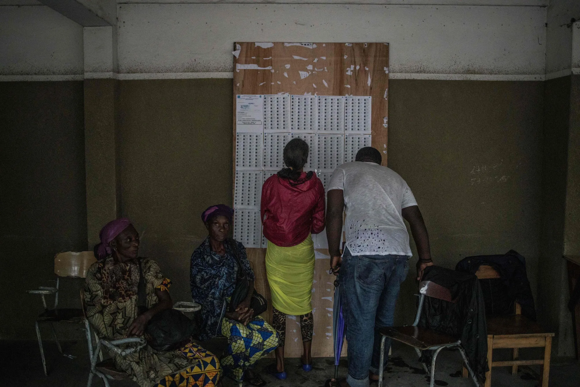 Voters check the roll at a polling station&nbsp;in Kinshasa on Dec. 30.