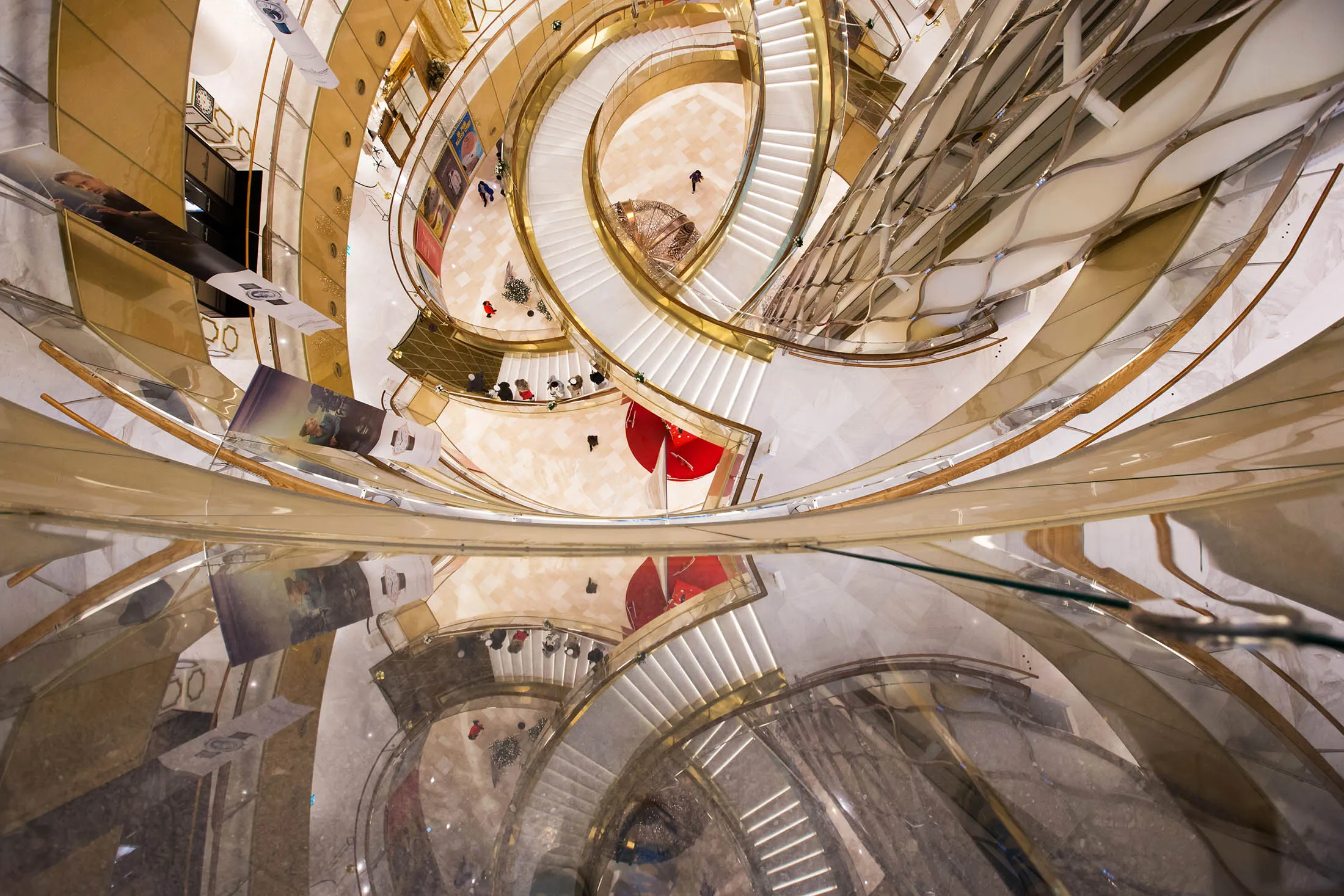 Shoppers walk on staircases at the Lotte World Mall in Seoul.
