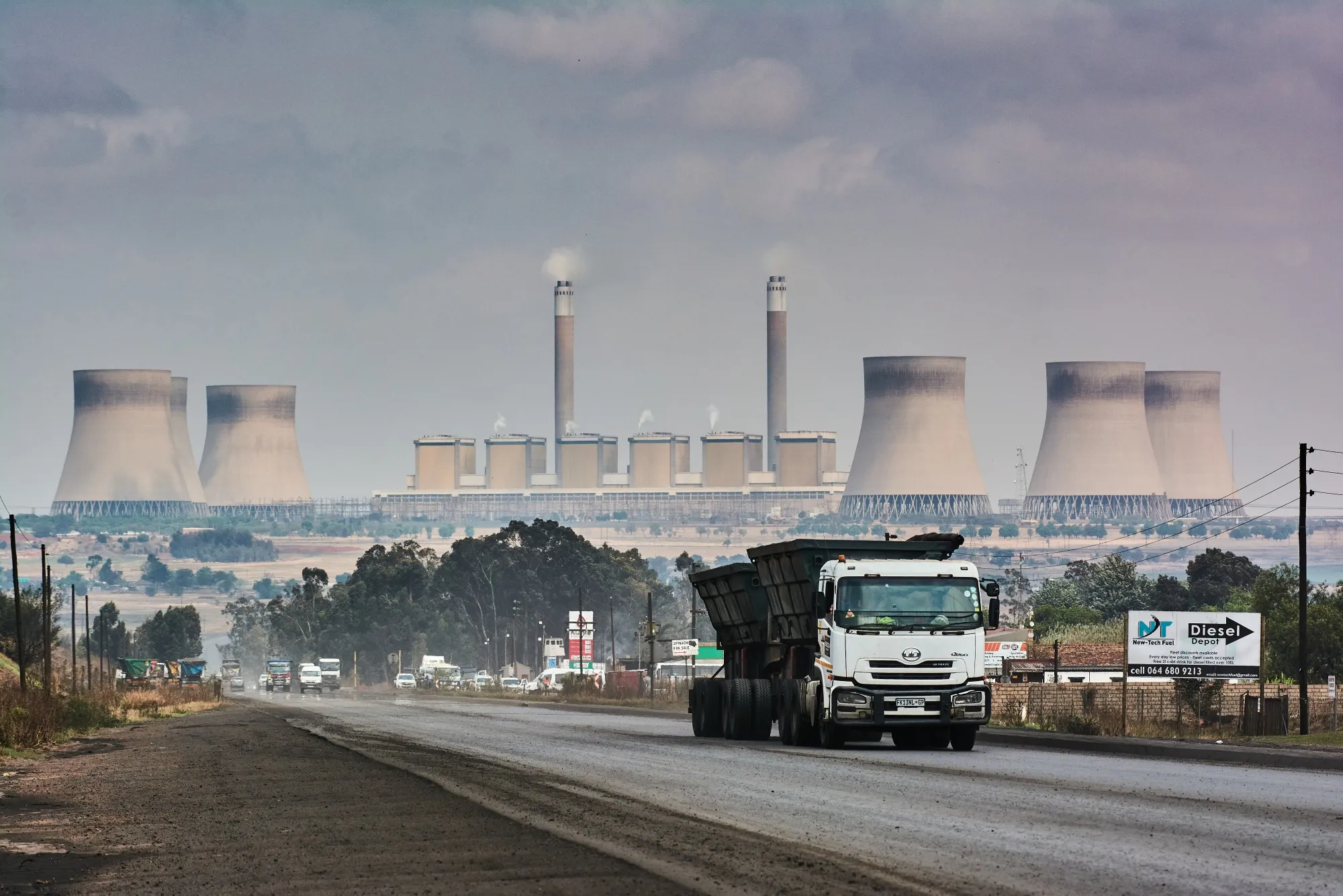 A truck drives by the Kendal coal-fired power station, operated by Eskom Holdings SOC Ltd., in Mpumalanga, South Africa.