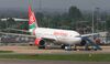 A Kenya Airways jet is parked at London's Heathrow International Airport.