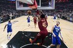 Cleveland Cavaliers guard Donovan Mitchell (45) dunks the ball during the first half of an NBA basketball game against the Los Angeles Clippers in Los Angeles, Monday, Nov. 7, 2022. (AP Photo/Ashley Landis)