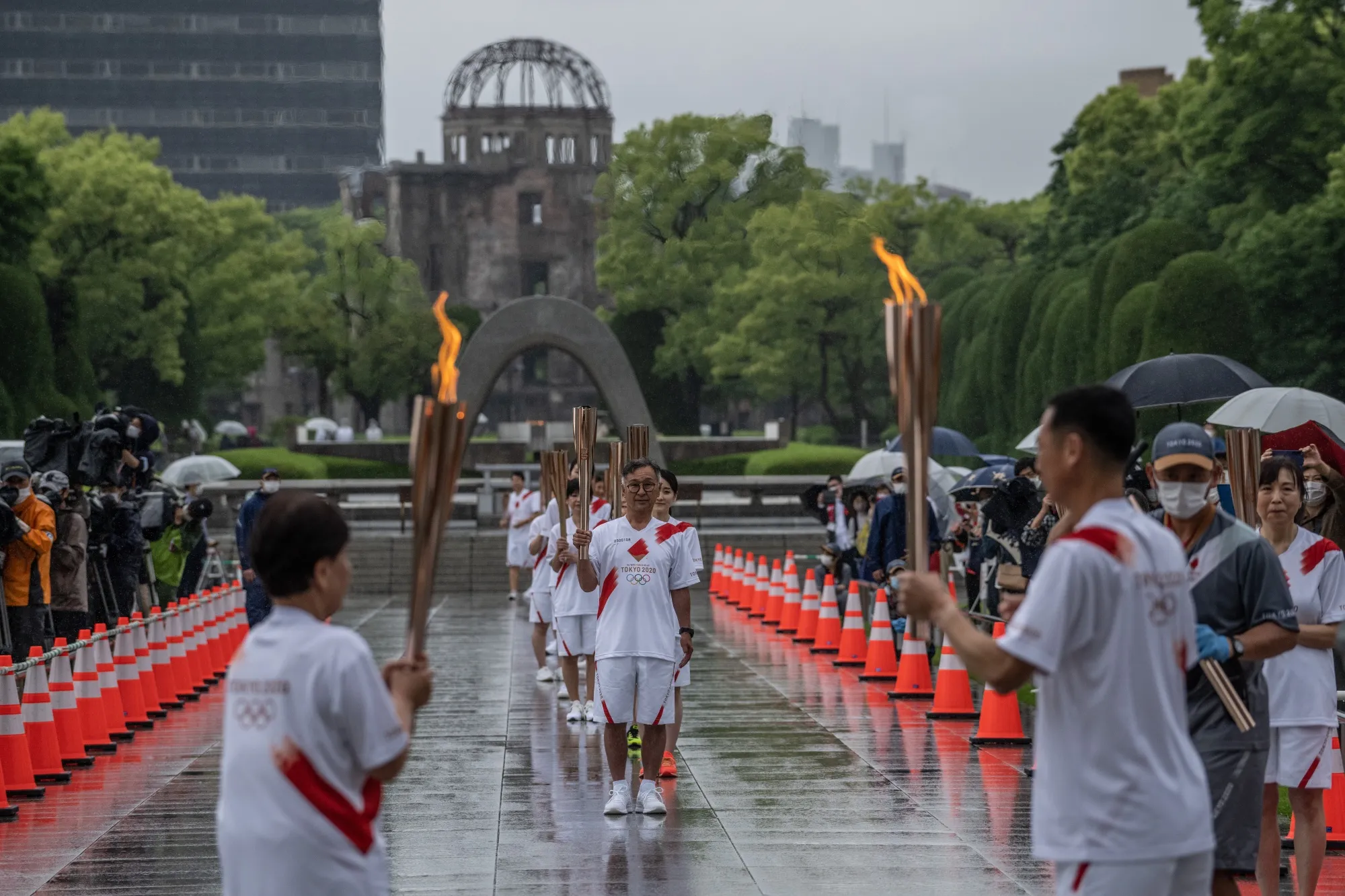 Torch bearers during a relay in the Hiroshima Peace Park on May 17.