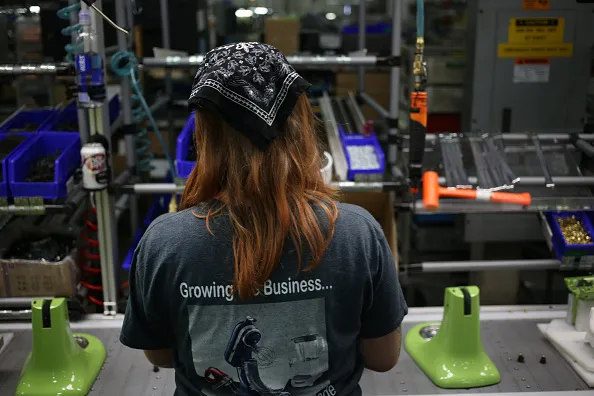 A worker assembles stand mixers on the production line at the Whirlpool Corp. KitchenAid manufacturing facility in Greenville, Ohio.
