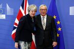Theresa May, U.K. prime minister, left, and Jean-Claude Juncker, president of the European Commission