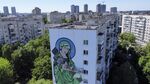 A worker paints a &quot;Saint Javelin&quot;, a Virgin Mary holding an American-made anti-tank missile, in Kyiv, Ukraine, Tuesday, May 24, 2022. (Photographer: Natacha Pisarenko/AP)