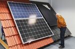 A man looks at different solar modules at an in-house exhibition of Heckert Solar GmbH, in Chemnitz, Germany.&nbsp;