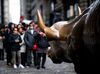 Tourists flock around the "Charging Bull" on January 9, 2019 in New York. (Photo by Johannes EISELE / AFP) (Photo credit should read JOHANNES EISELE/AFP/Getty Images)