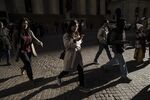Pedestrians walk on Wall Street near the New York Stock Exchange (NYSE) in New York, U.S.