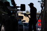 A customer fuels a vehicle at a gas station in Hercules, California, on&nbsp;June 22.