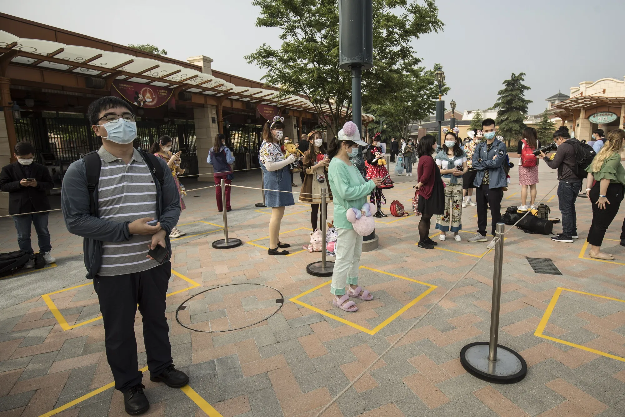 Visitors attend the&nbsp;reopening of the Walt Disney Co. Shanghai Disneyland on May 11.