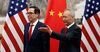 Chinese Vice Premier Liu He (R) shows the way to US Treasury Secretary Steven Mnuchin as they proceed for their meeting at the Diaoyutai State Guesthouse in Beijing on May 1, 2019.
