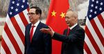 Chinese Vice Premier Liu He (R) shows the way to US Treasury Secretary Steven Mnuchin as they proceed for their meeting at the Diaoyutai State Guesthouse in Beijing on May 1, 2019.