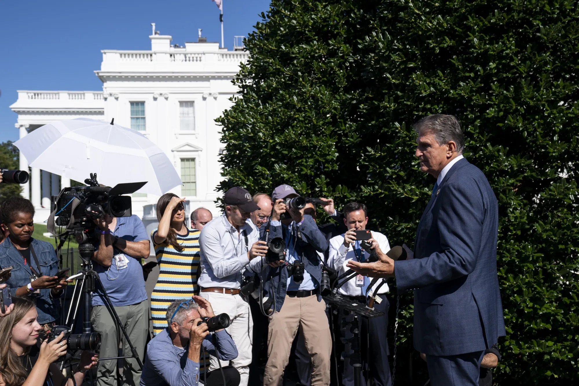 Senator Joe Manchin&nbsp;speaks to members of the media outside of the White House in August.&nbsp;