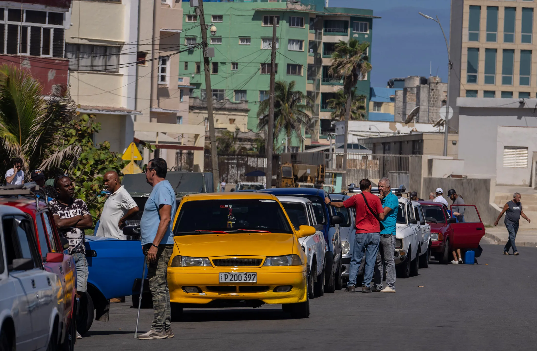 People wait in line to refuel their cars at a gas station in Havana, on April 18.