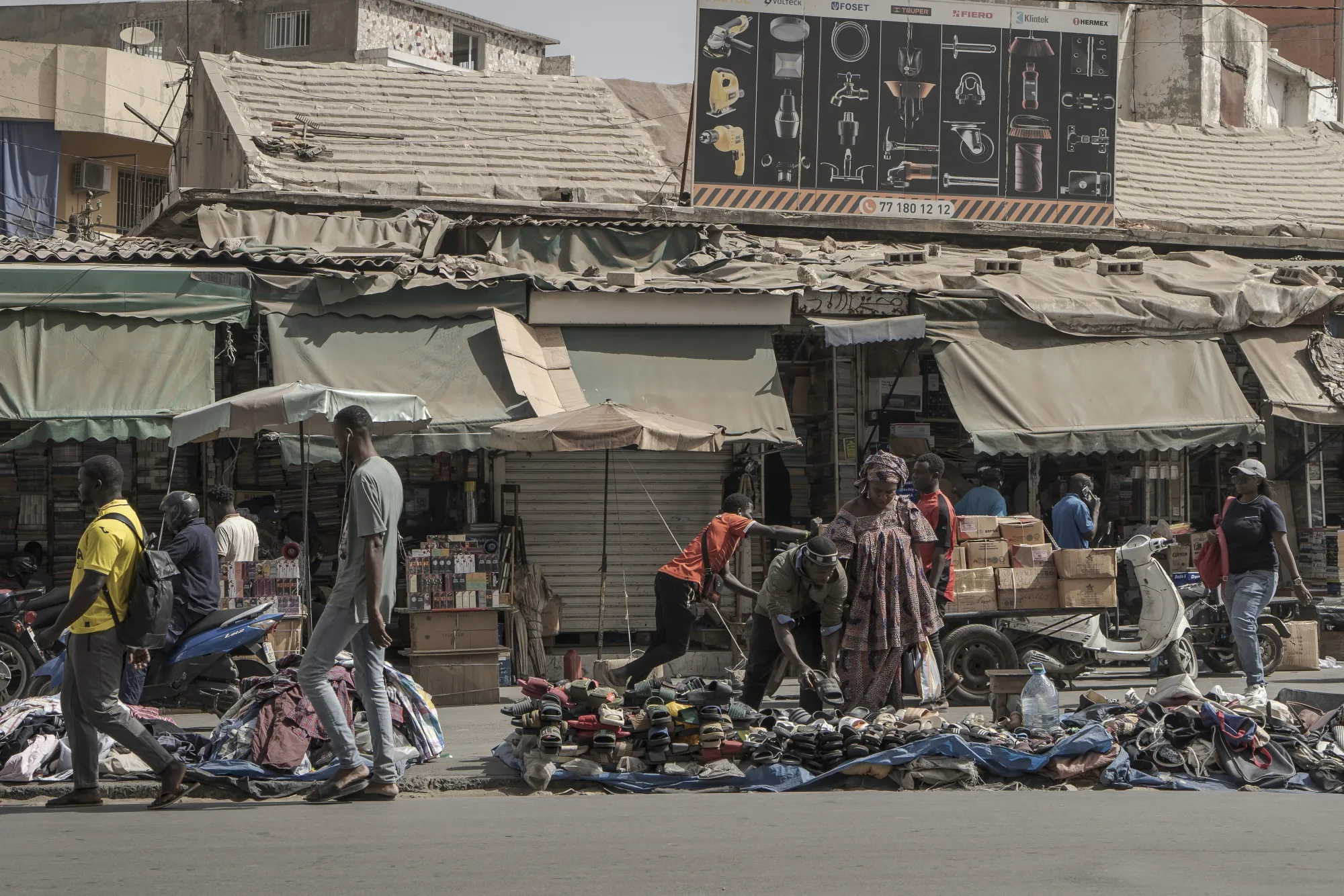 Street traders lay out their goods at Sandaga market in Dakar.