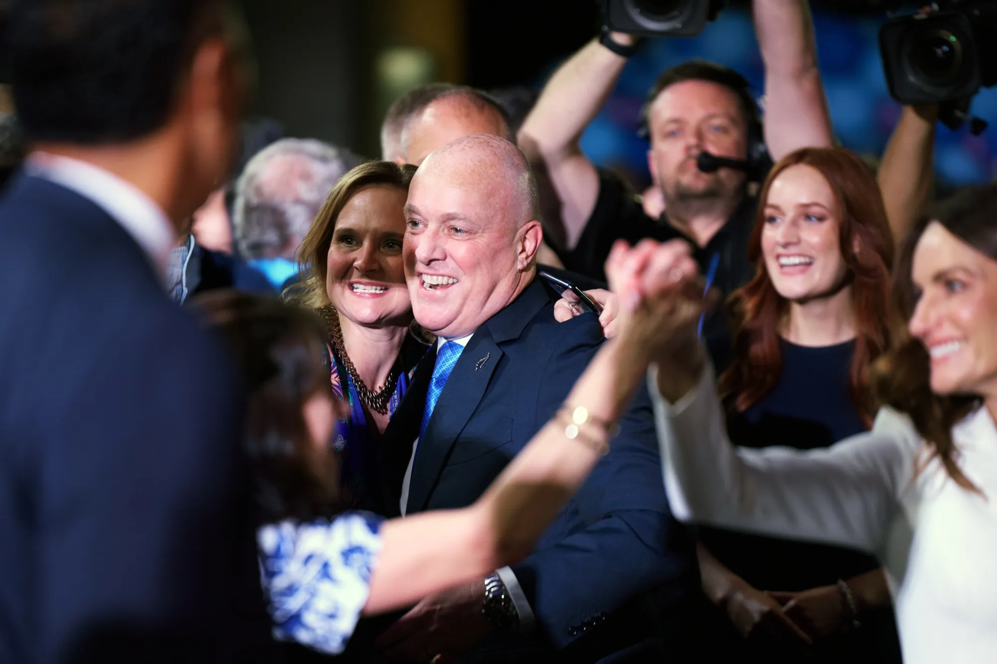 Christopher Luxon, center, celebrates with his supporters in Auckland on Oct. 14.