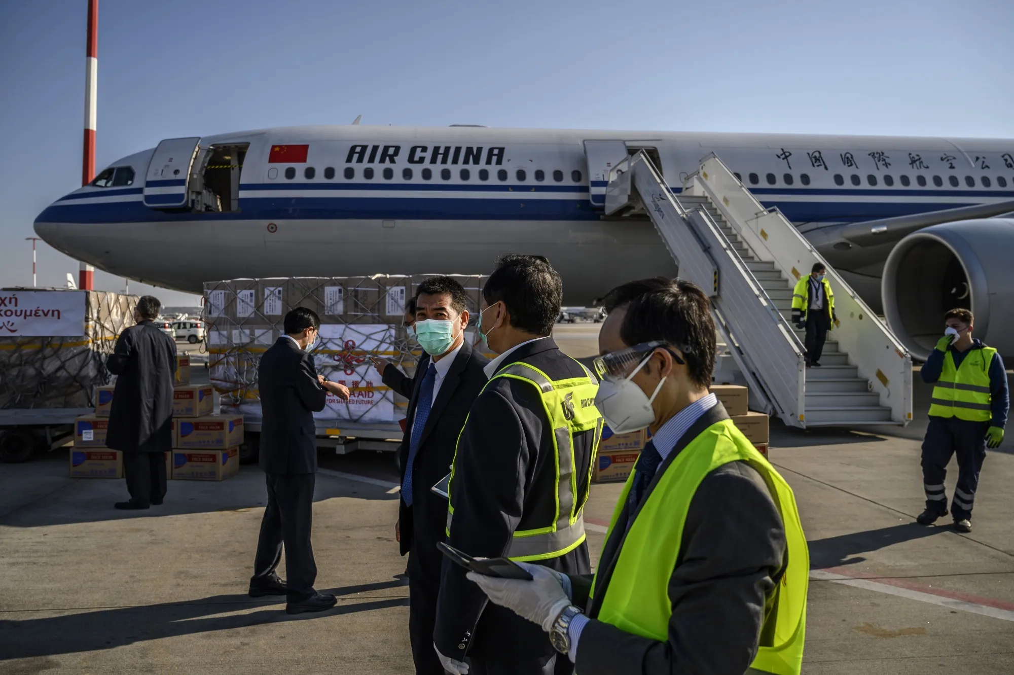 Medical supplies sit in front of an Air China aircraft at Athens Eleftherios Venizelos International Airport in Greece, March 21.