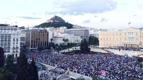 Greeks protest outside the parliament in Athens on June 18, against the government and in support of the country's membership in the euro area. The rally took place as a euro area finance ministers meeting in Luxembourg ended in acrimony.