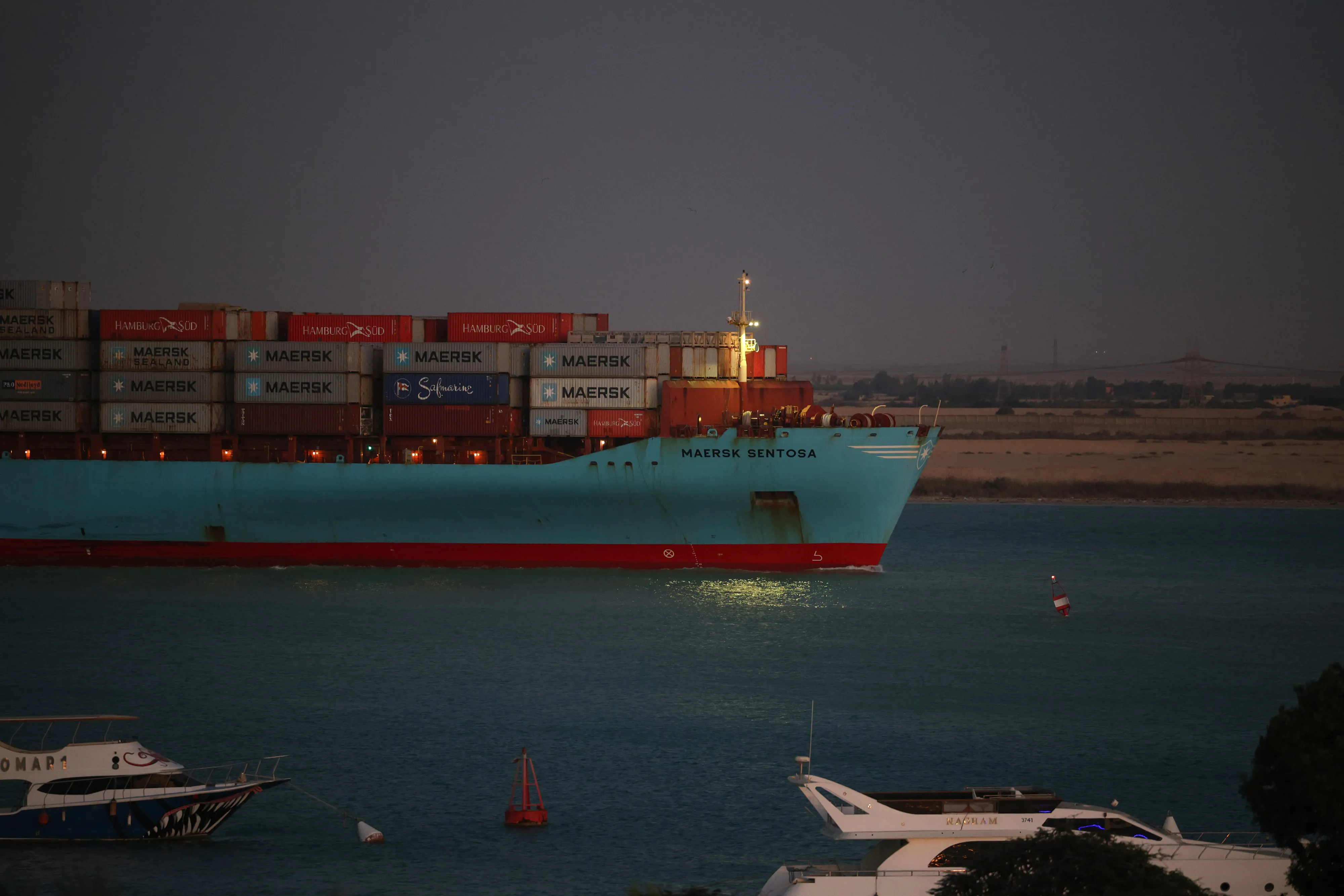 A container ship sails southbound to exit the Suez Canal in Suez, Egypt, on Thursday, Dec. 21, 2023.