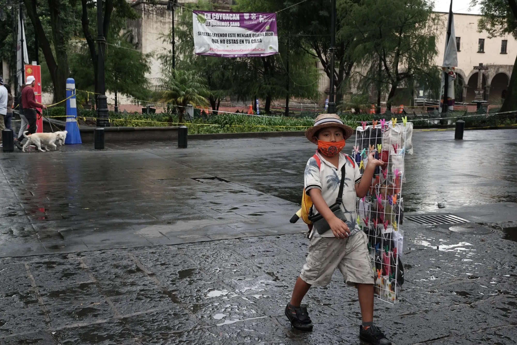 A young boy sells masks and other medical items during the covid outbreak in Mexico City