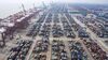Gantry cranes stand next to shipping containers at the Port of Nansha in the Nansha district of Guangzhou, China.