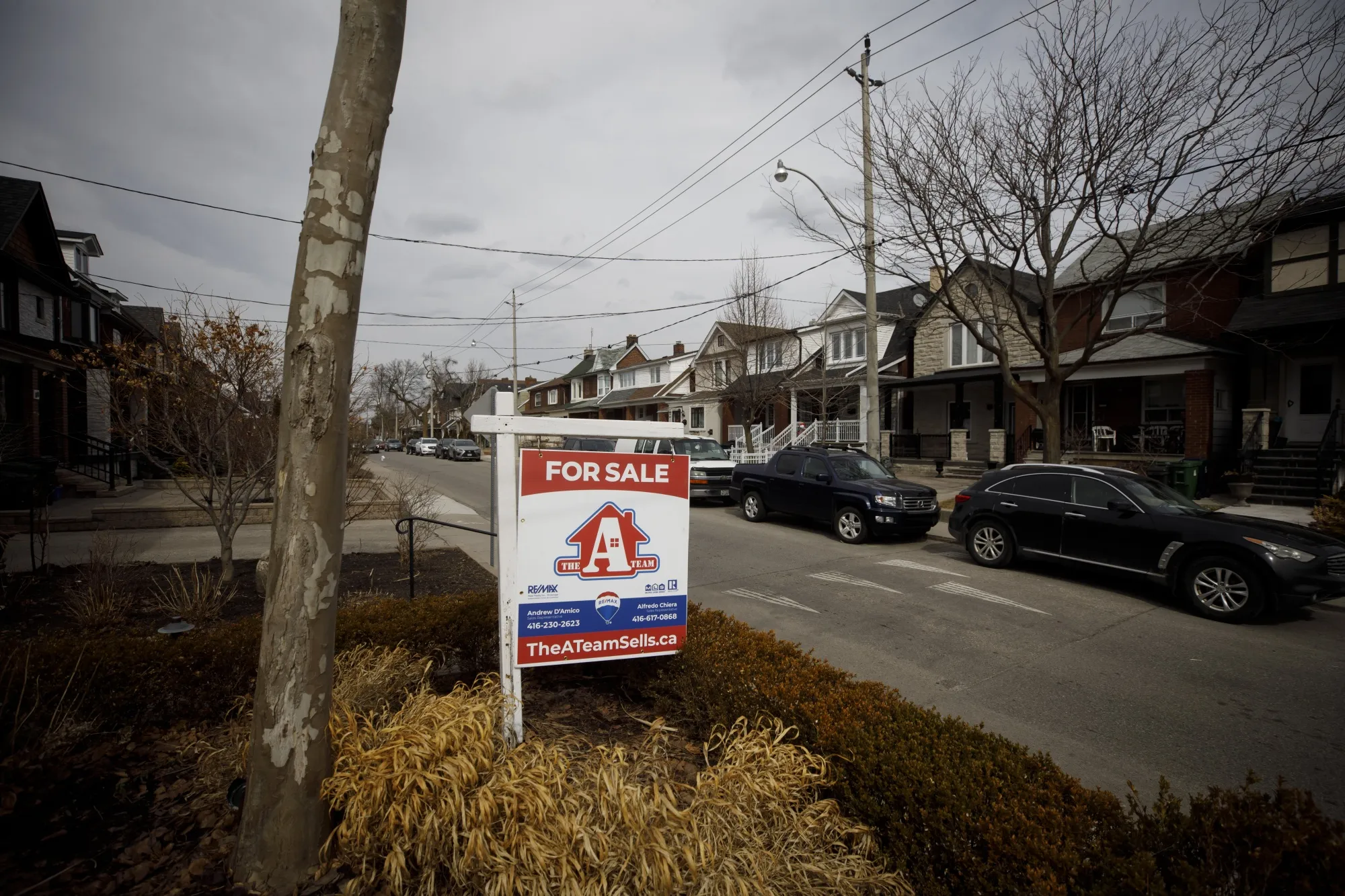 A "For Sale" sign in front of a home in the York neighborhood of Toronto, Ontario, Canada, on Thursday, March 11, 2021.&nbsp;Canadian home prices fell by the most on record in 2022, as rapidly rising interest rates forced a market adjustment that may have further to go.&nbsp;