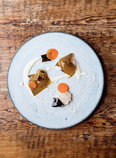 Raw Orkney scallops, kelp, oyster cream, carrots, and horseradish at Clove Club.