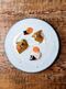 Raw Orkney scallops, kelp, oyster cream, carrots, and horseradish at Clove Club.