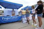 Project 2025 representatives talk to fairgoers at the Iowa State Fair on Aug. 14.
