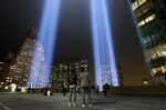 People observe the 'Tribute in Light' in lower Manhattan on&nbsp;Sept.&nbsp;11, 2018.