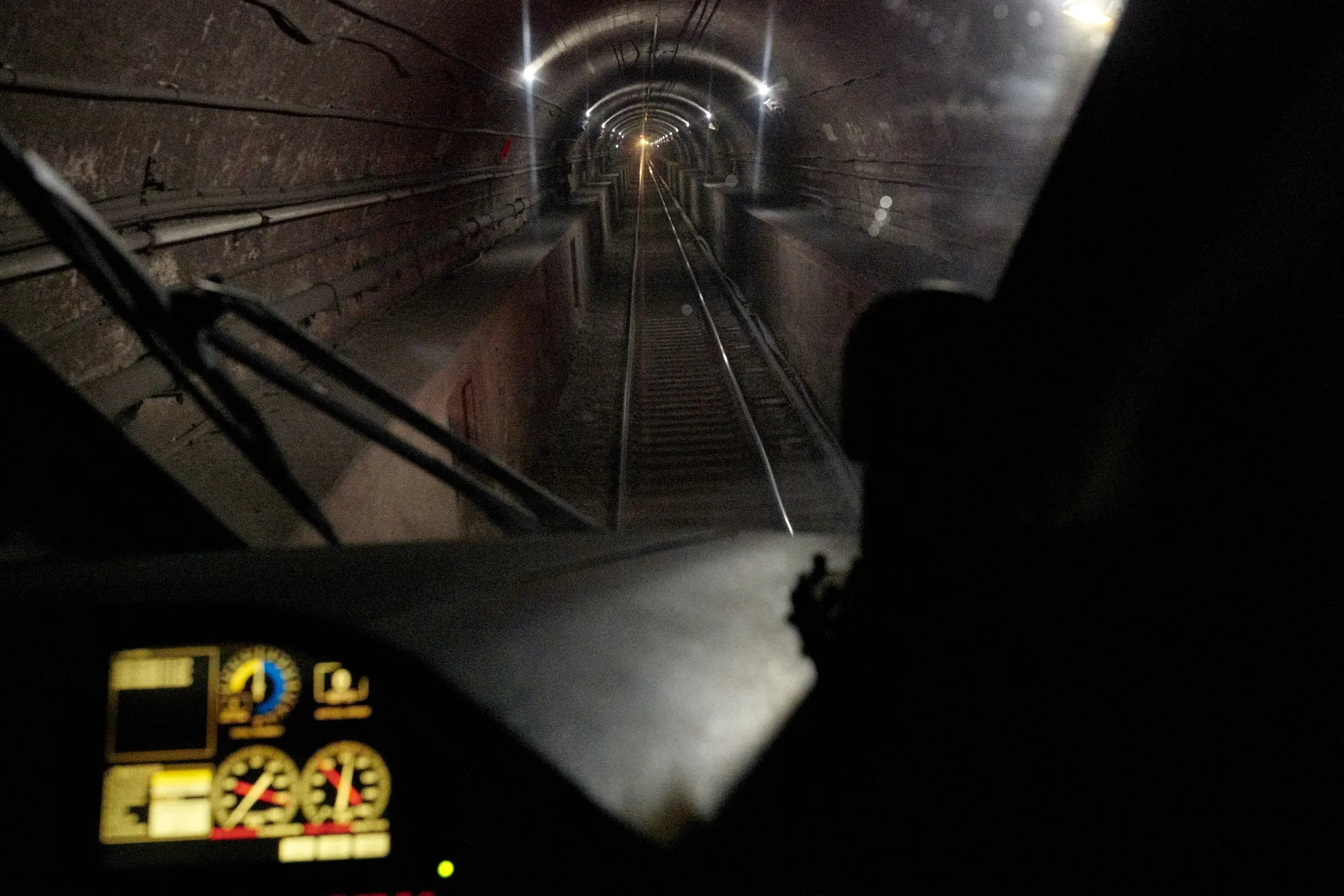 A train travels through the North River tunnel from Newark, New Jersey, towards New York.