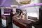 Flight crew show visitors through the bar area for business class passengers aboard an Airbus A380-800 aircraft, operated by Qatar Airways Ltd., on the opening day of the 14th Dubai Air Show at Dubai World Central (DWC) in Dubai, United Arab Emirates, on Sunday, Nov. 8, 2015. The Dubai Air Show is the biggest aerospace event in the Middle East, Asia and Africa and runs Nov. 8 - 12. Photographer: Jasper Juinen/Bloomberg