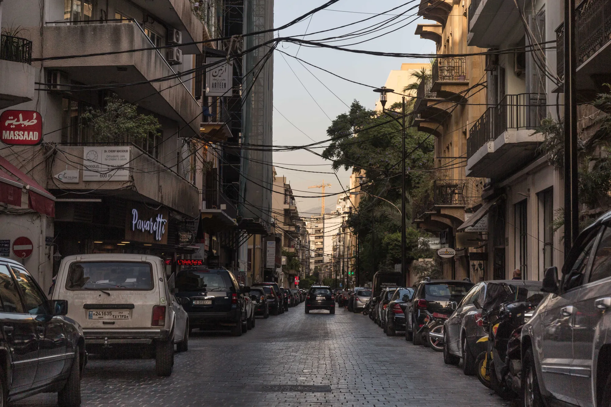 Automobiles line a street in the neighborhood of Gemmayze, populated with bars and cafes, Beirut, Lebanon, on Tuesday, July 24, 2018.
