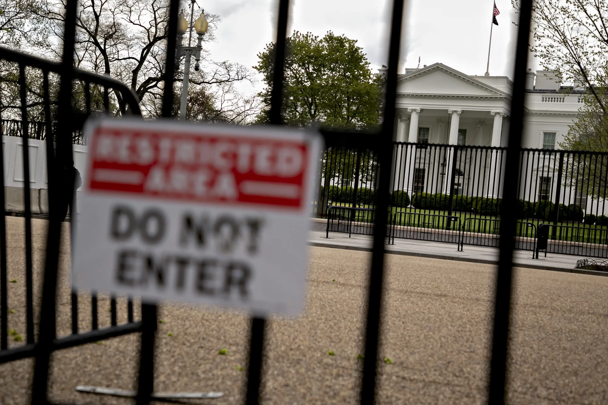 The White House stands past fencing in Washington, D.C.&nbsp;