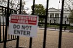 The White House stands past fencing in Washington, D.C. 