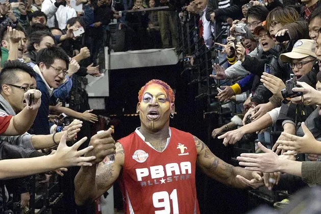 Rodman enters the arena in Macau for a game on the 2011 U.S. Pro-ball Legend Asia Tour 