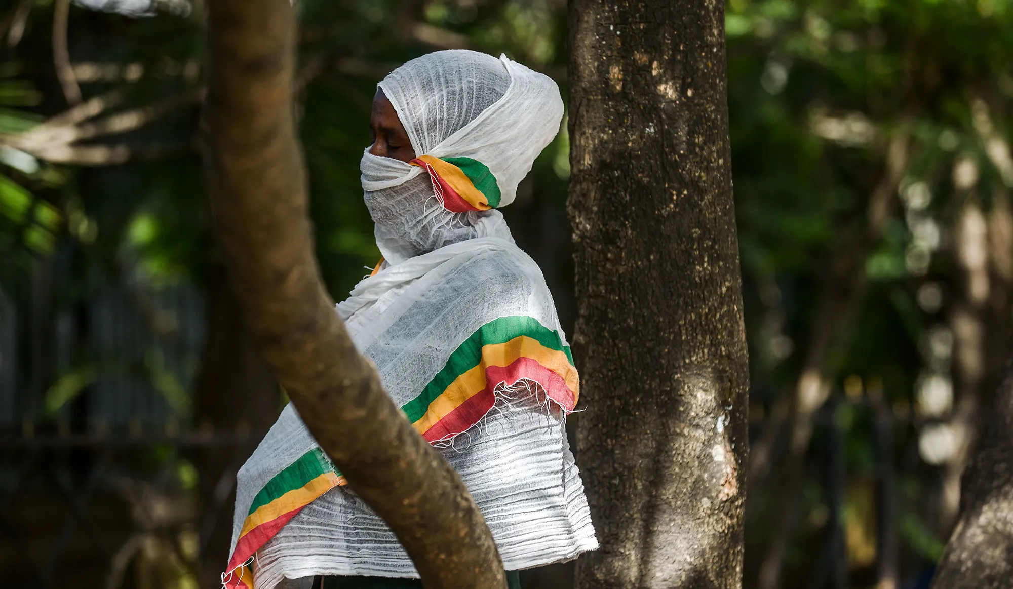 A woman prays outside a closed cathedral&nbsp;in Addis Ababa on April 5.