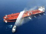 An Iranian navy boat tries to containe the fire on the Front Altair tanker in the Gulf of Oman on June 13.