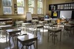 Socially distanced desks inside a classroom at Blessed Sacrament Catholic School as it prepares to reopen in Toronto, Ontario, Canada, on Friday, Sept. 4, 2020. Ontario's largest school board says nearly one-third of elementary school students and 22 per cent of high school students will learn from home in the upcoming school year, the National Post reported. Photographer: Cole Burston/Bloomberg
