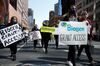 Demonstrators on their way to Biogen headquarters during a rally for Lisa Stockman-Mauriello, in Cambridge, Massachusetts, on March 30. 