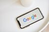 The Google Inc. logo is displayed on an Apple Inc. iPhone in this arranged photograph taken in the Brooklyn borough of New York, U.S., on Friday, July 19, 2019. Alphabet Inc. is scheduled to release earnings figures on July 25.