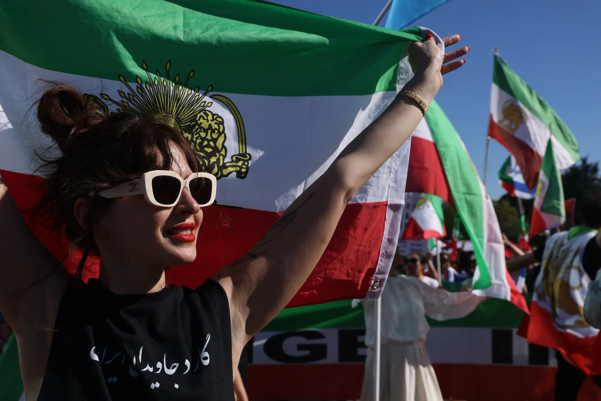 Sophie Kiani joins hundreds in a rally seeking regime change in Iran in the Westwood neighborhood of Los Angeles on&nbsp;Feb. 28.