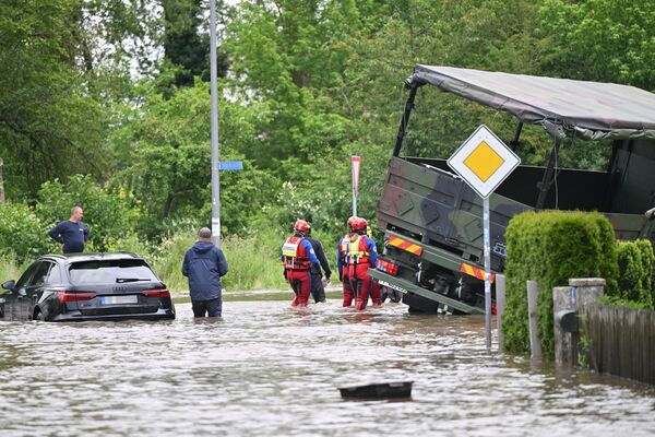 Emergency services at the scene of a stuck army truck and passenger vehicle in Baar-Ebenhausen, Germany, on June 2.