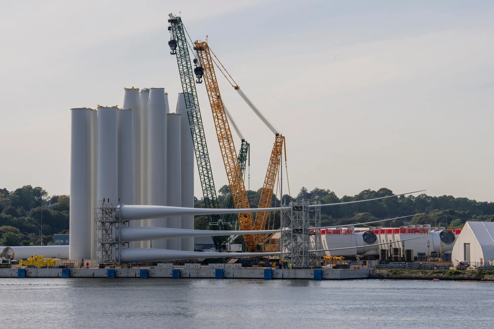 The Revolution Wind project assembly site at State Pier in New London, Connecticut. Orsted A/S will resume work on its nearly-completed wind farm off the coast of Rhode Island after a US judge ruled construction can continue.