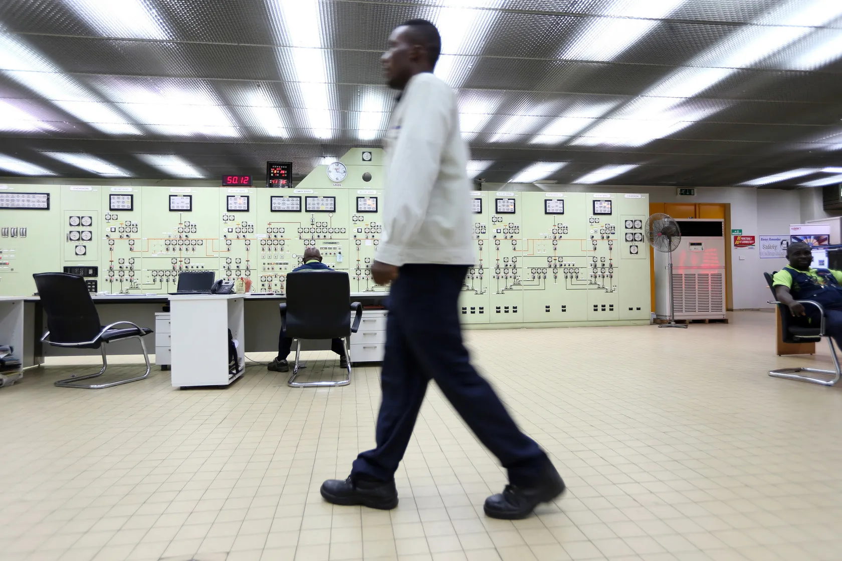 Employees work in the control room of the newly renovated energy generation plant in Lagos, Nigeria.
