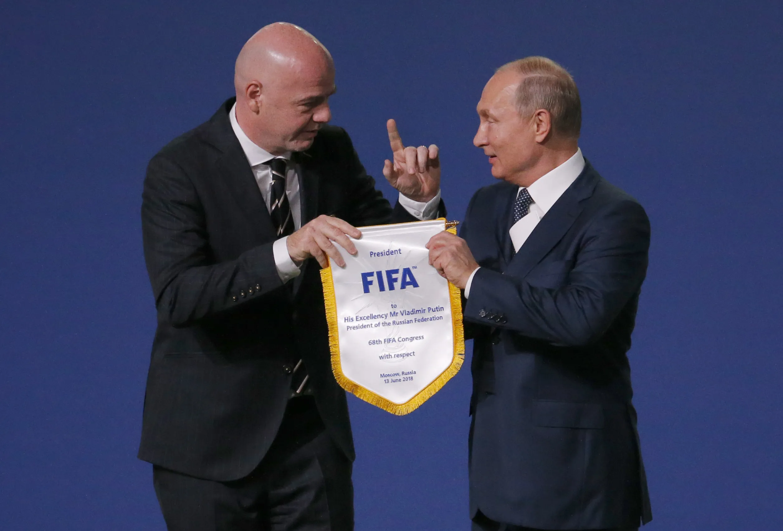 FIFA President Gianni Infantino, left, and Russian President Vladimir Putin pose for cameras at the FIFA congress on the eve of the opener of the 2018 soccer World Cup in Moscow, Russia, Wednesday, June 13, 2018. In a sweeping move to isolate and condemn Russia after invading Ukraine, the International Olympic Committee urged sports bodies on Monday to exclude the country's athletes and officials from international events. The decision opened the way for FIFA, the governing body of soccer, to exclude Russia from a World Cup qualifying playoff match on March 24. Poland has refused to play the scheduled game against Russia. (AP Photo/Alexander Zemlianichenko, File)