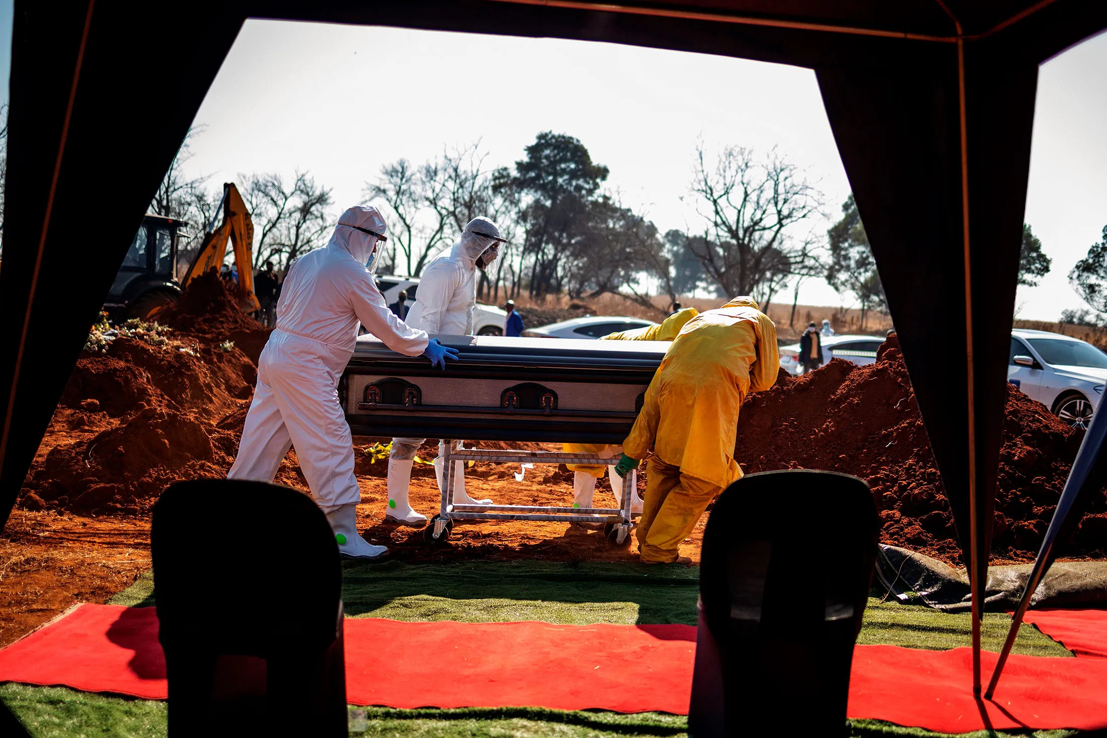Undertakers bury the remains of a&nbsp;coronavirus patient at a cemetery in Soweto, on July 21.