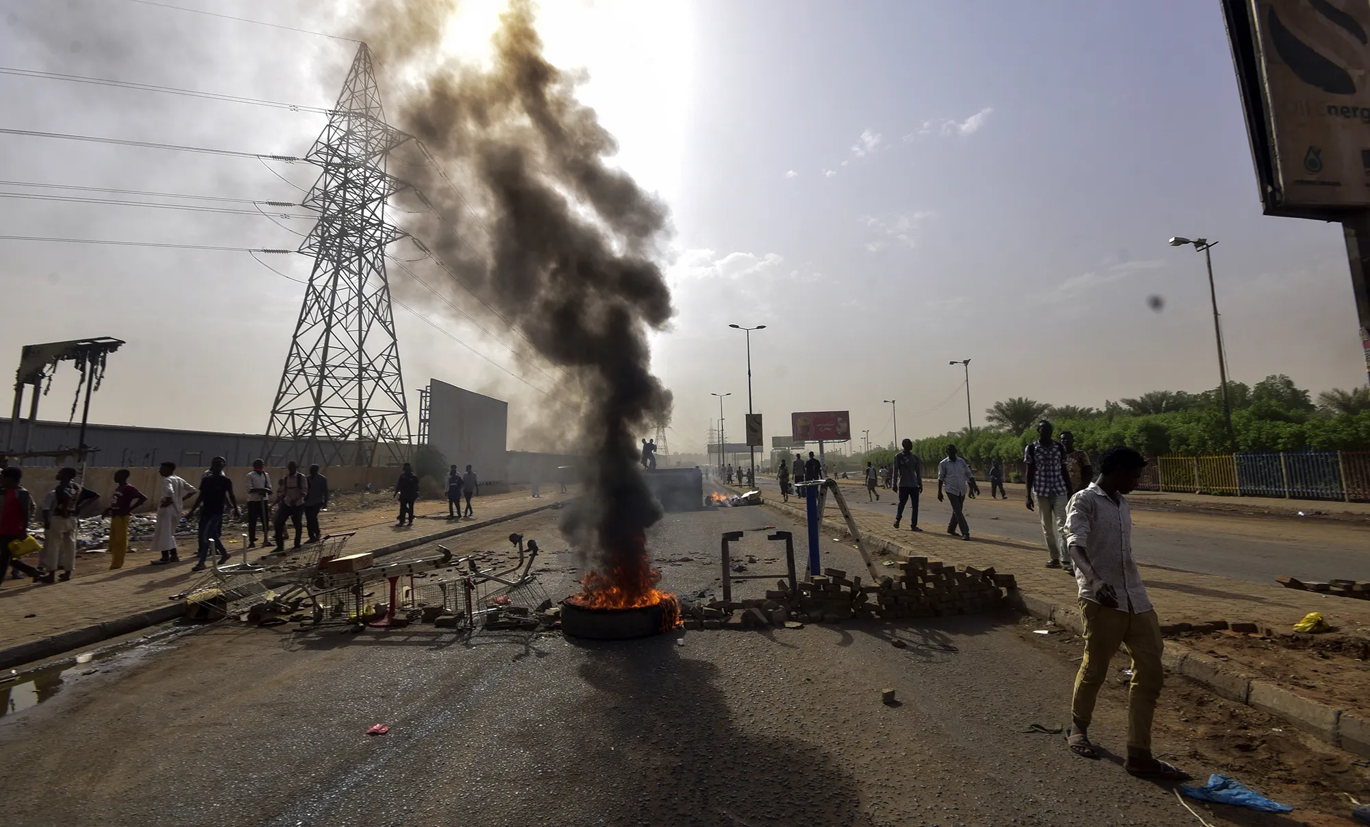 Sudanese protesters burn tires and barricade the road in Khartoum's twin city of Omdurman on June 3, 2019.&nbsp;