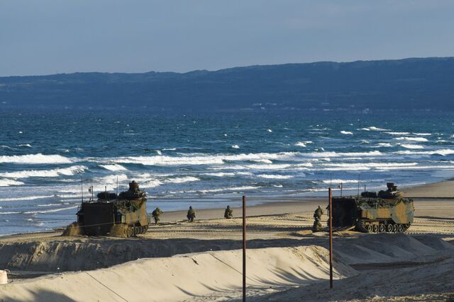Japanese soldiers practicing an amphibious landing on Tanegashima last November.